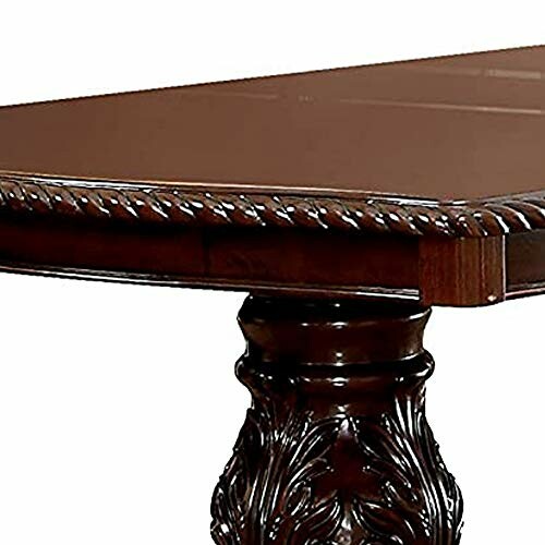 Elegant wooden dining table corner with ornate carved leg