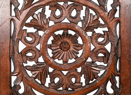 Intricate wood carving with floral pattern