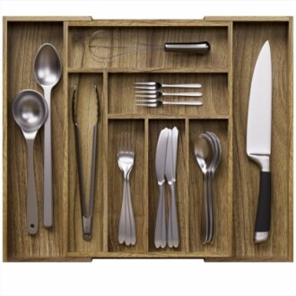 Organized cutlery drawer with assorted utensils.