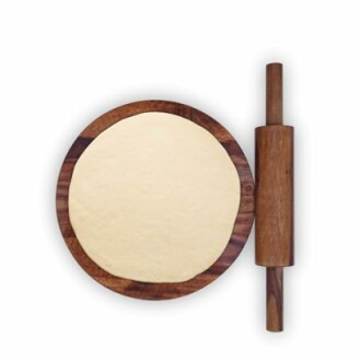 Pizza dough on wooden board with rolling pin