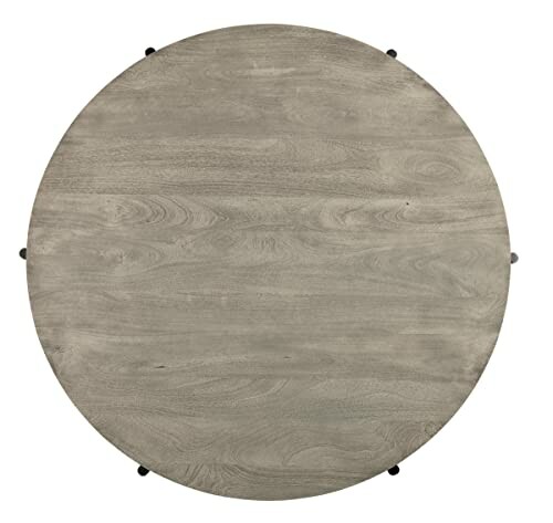 Round wooden tabletop with a smooth finish.