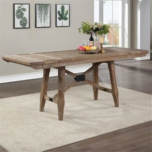 Rustic wooden dining table with fruit and plants.