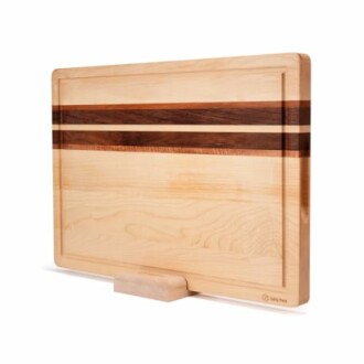 Wooden cutting board with decorative inlay