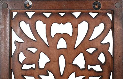 Intricately carved wooden panel with floral design.