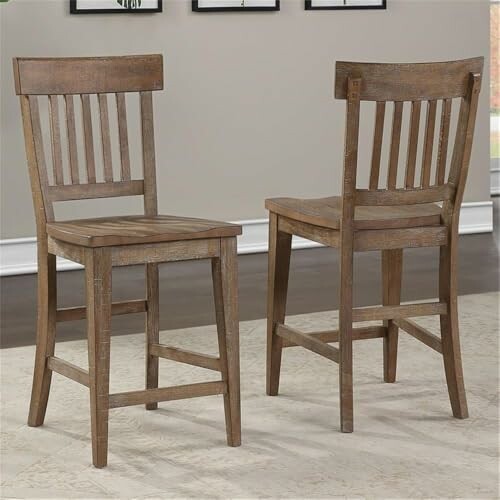 Two wooden dining chairs with slatted backs