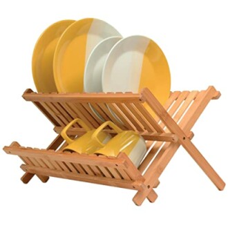 Wooden dish rack holding plates and cups