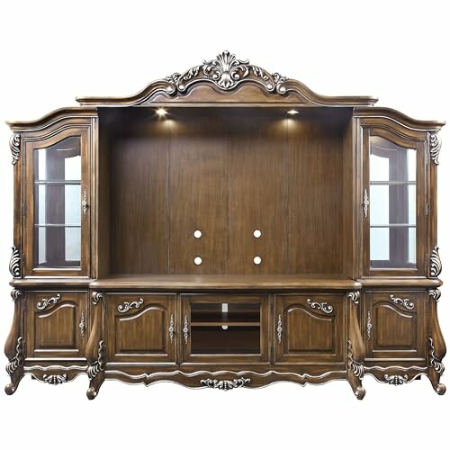 Ornate wooden display cabinet with glass doors and storage