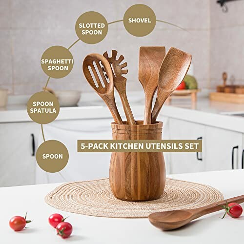 Wooden kitchen utensils set with five items in a holder on a kitchen counter.