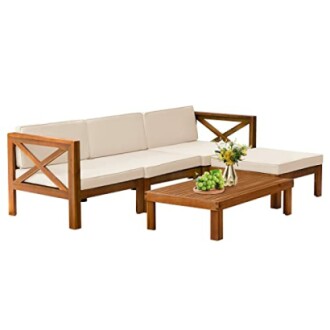 Outdoor wooden patio furniture set with beige cushions and a coffee table.