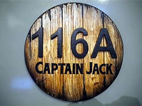 Wooden sign with text '116A Captain Jack'.