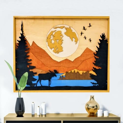 Wooden wall art with landscape scene featuring mountains, trees, and a moose.